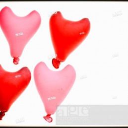 Group of four heart red shaped balloons.