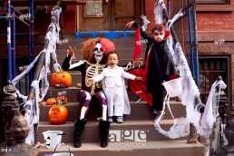 Mother and children wearing Halloween costumes