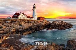 Portland Lighthouse Sunrise - The sun rises in Portland Head Lighthouse in Portland, Maine.